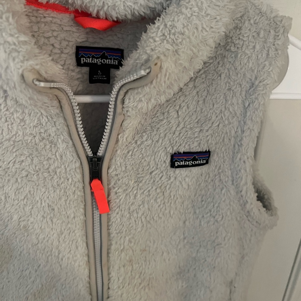 The North Face Girls Large light gray vest.
